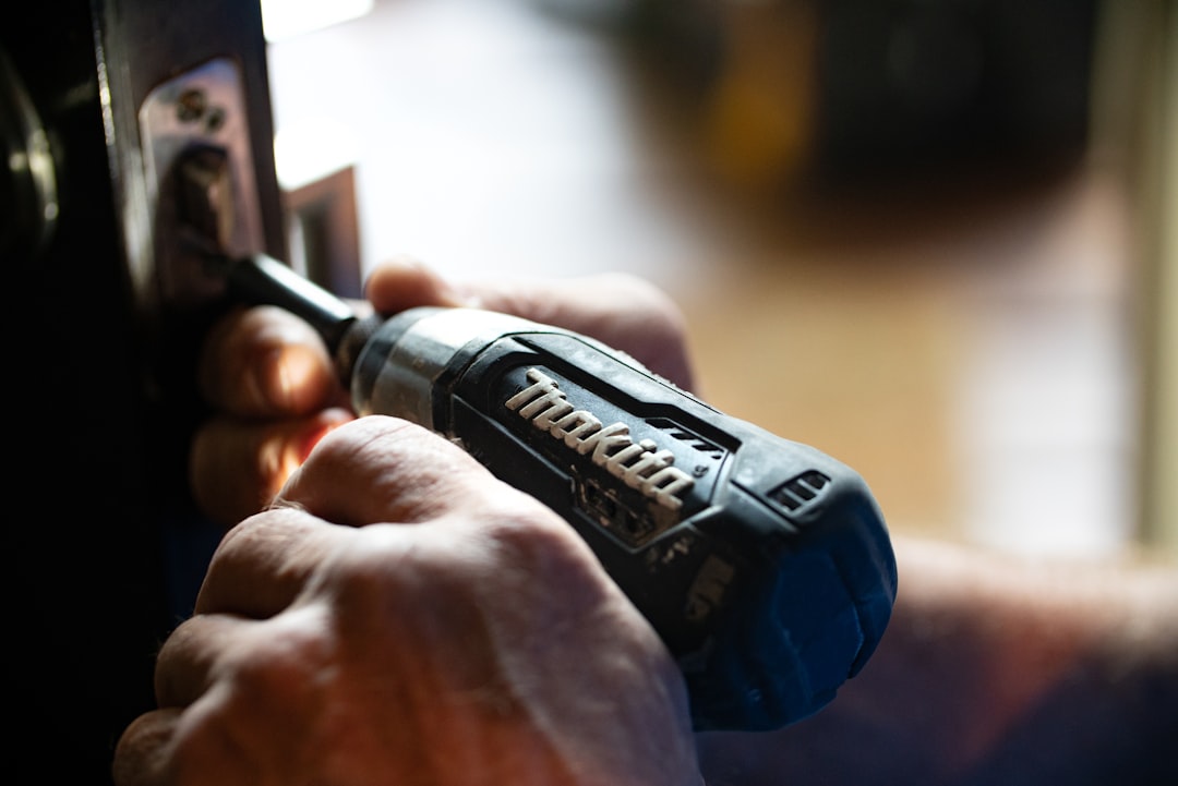 selective-focus-photography-blue-and-black-makita-power-drill-klby0nxsey8